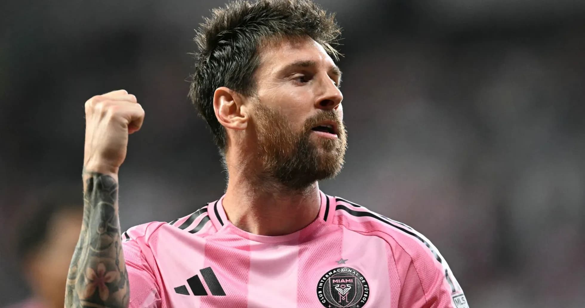 Player celebrating during a match in pink jersey