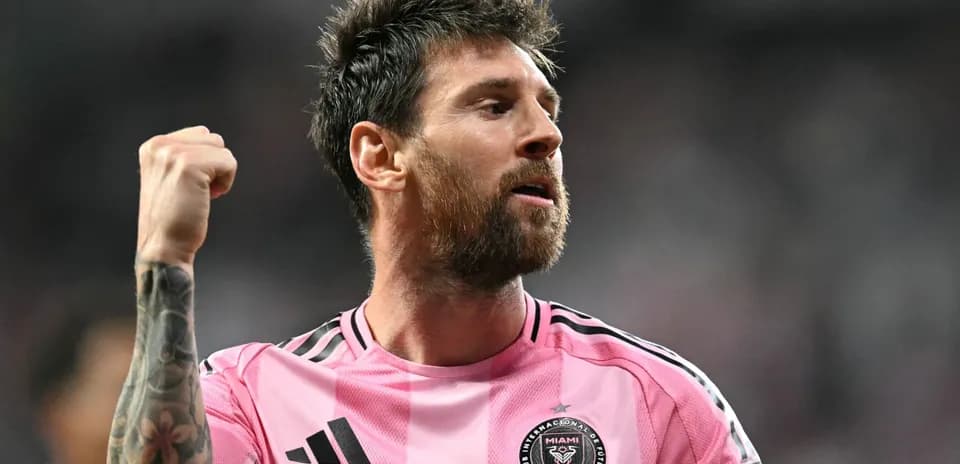 Player celebrating during a match in pink jersey