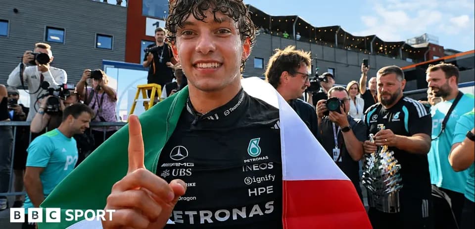 Driver celebrating with flags after race victory