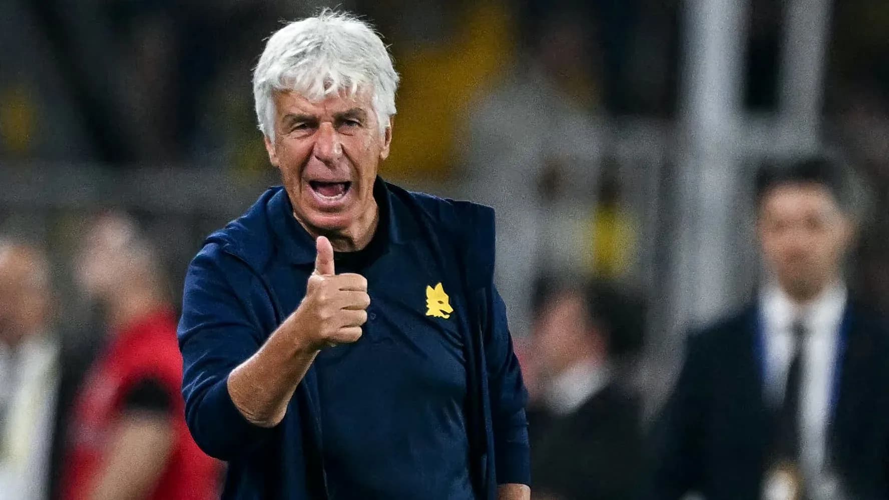 Coach giving thumbs up during match