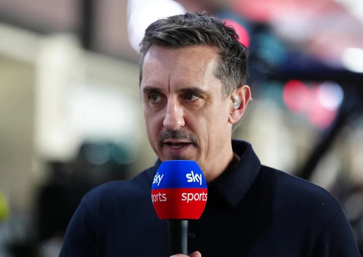 Sports commentator speaking into microphone during broadcast