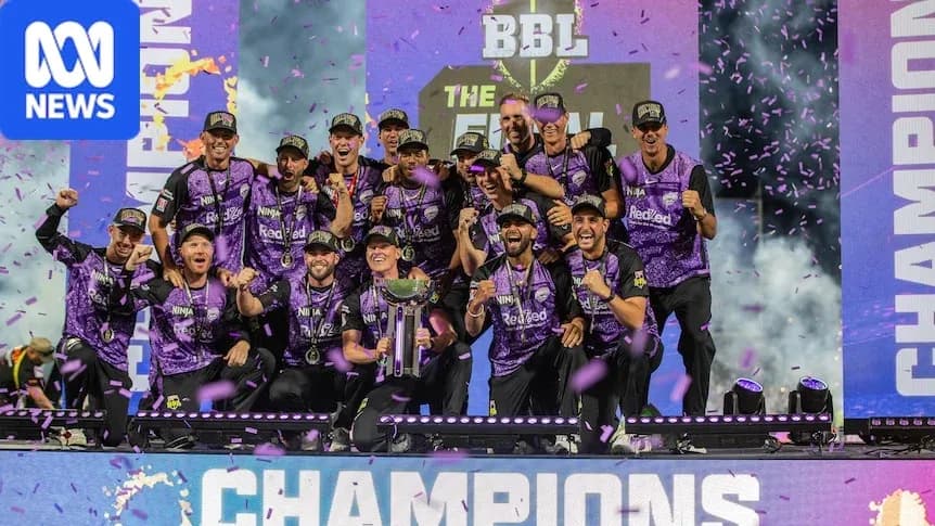 Team celebrating victory with trophy and confetti