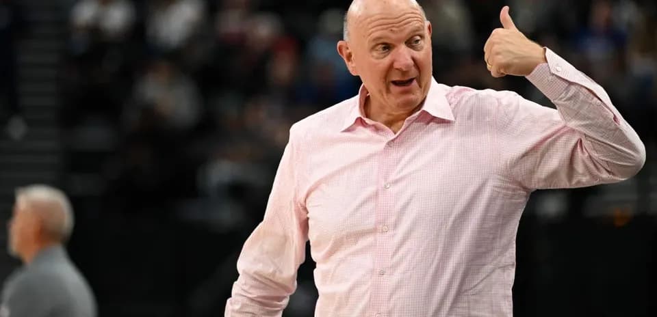 Person gesturing during basketball game event
