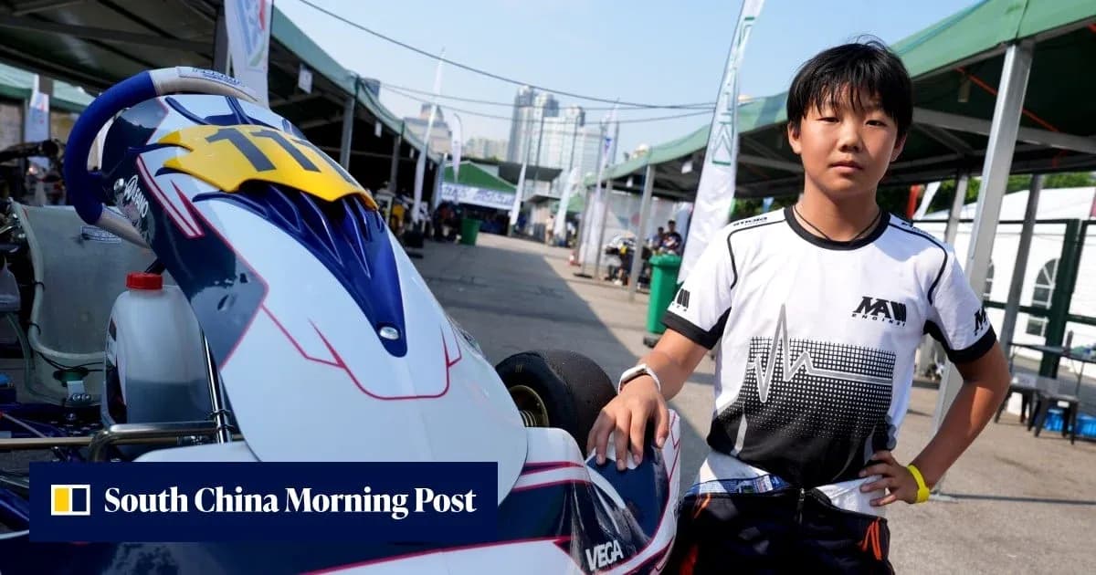 Young driver standing next to kart in paddock