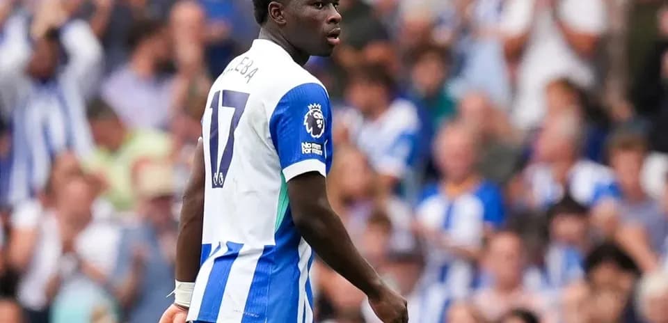 Player in Brighton kit on field during match