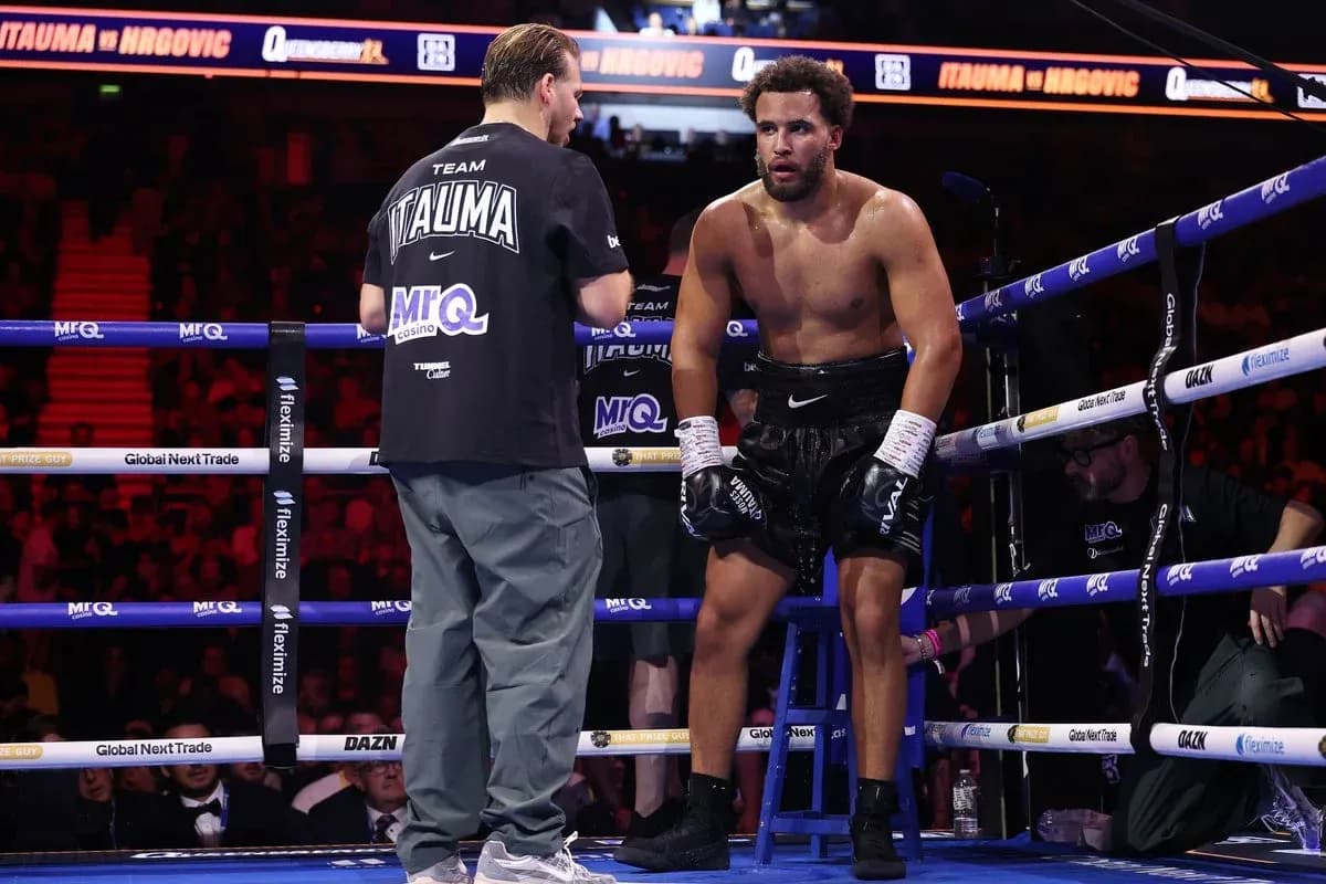 Boxer receiving advice from trainer in corner
