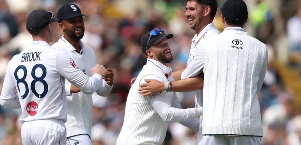 England cricket players celebrating a wicket together