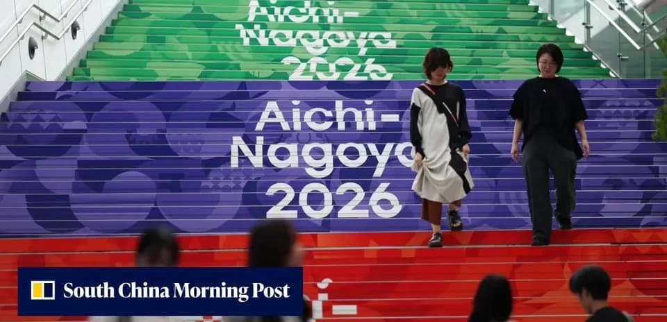 Two women walking down colorful Aichi-Nagoya 2026 stairs
