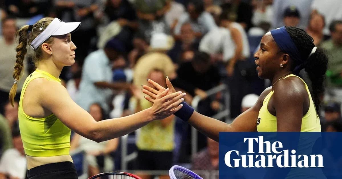 Two female tennis players shaking hands at match