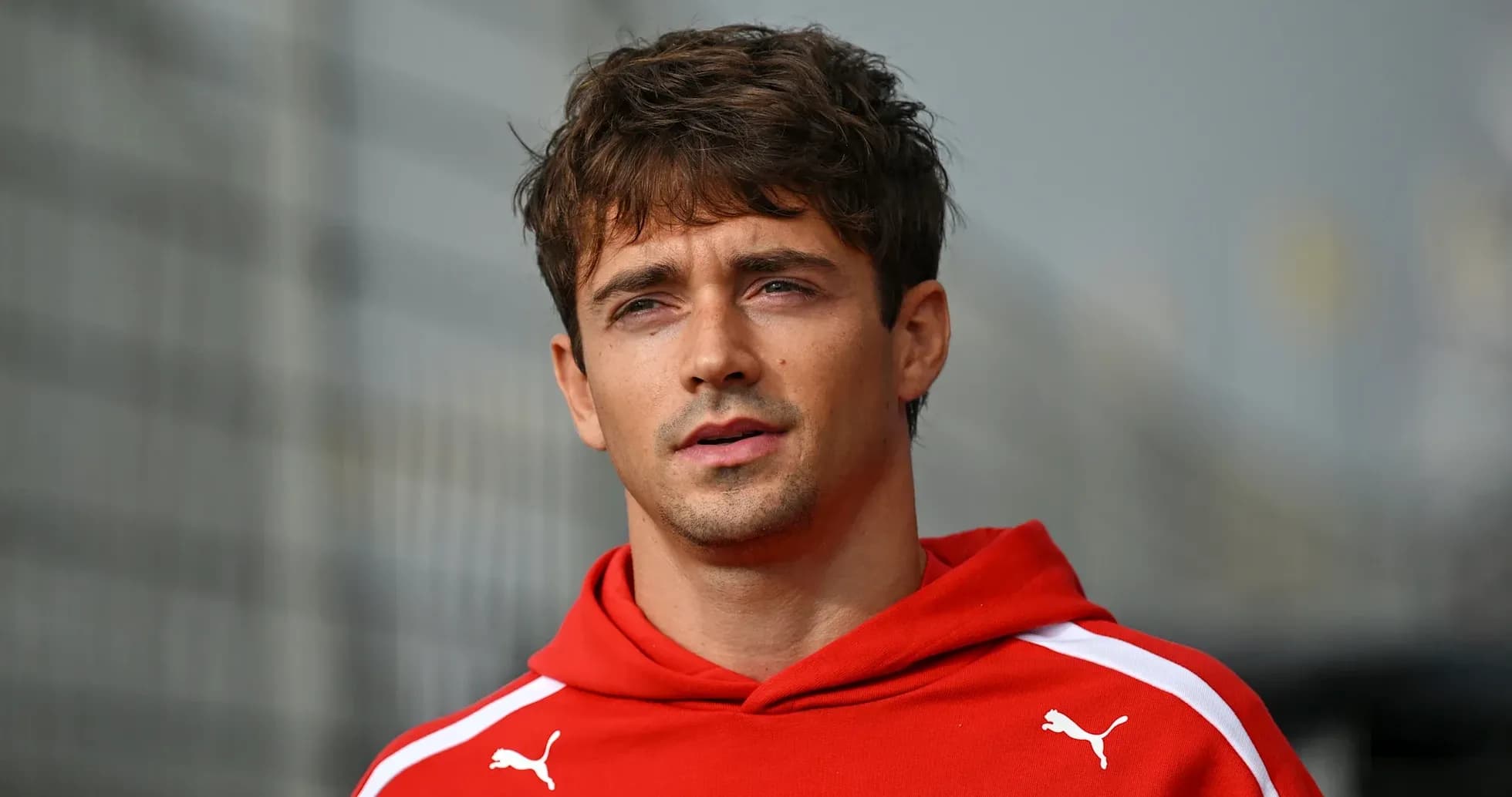 Athlete in red hoodie during outdoor event