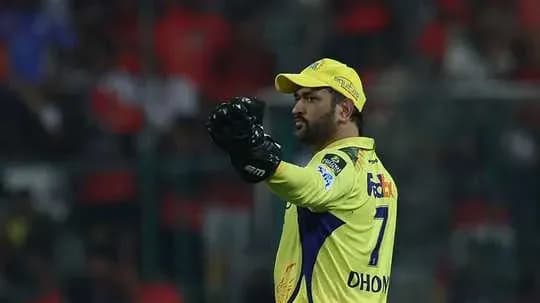 Player in yellow jersey signaling during match