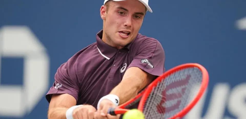 Player hitting a forehand during tennis match