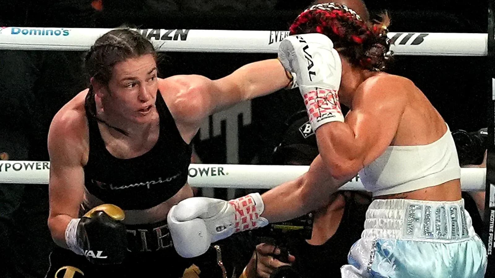 Boxers exchanging punches in a boxing match