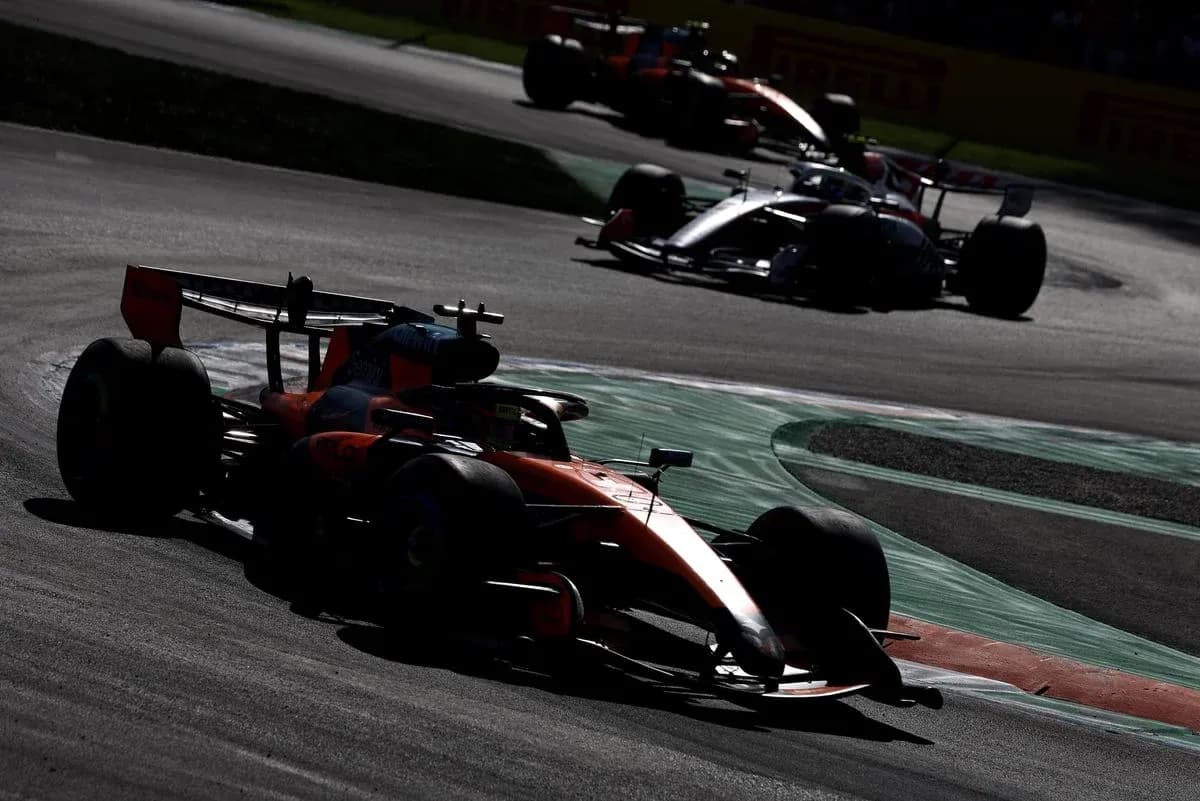 McLaren car navigating a turn during race