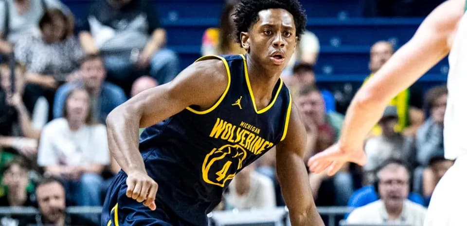 Player dribbling ball during Michigan Wolverines game