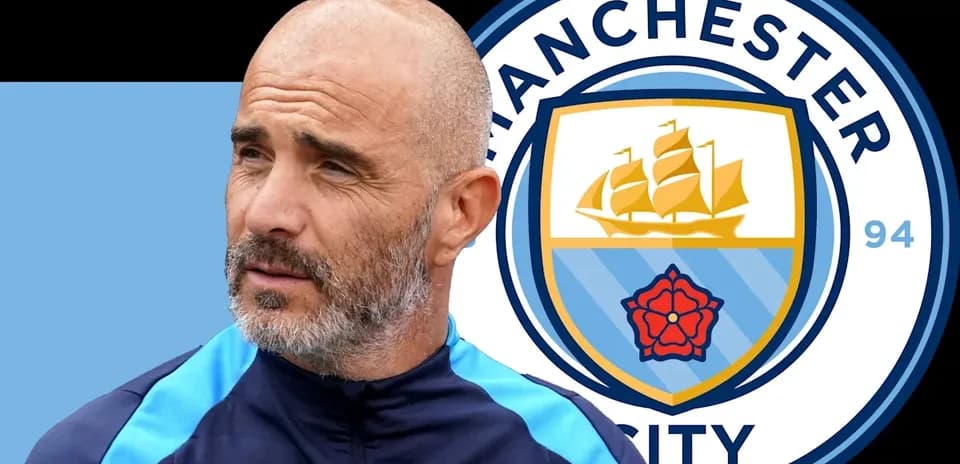 Coach with Manchester City logo in background