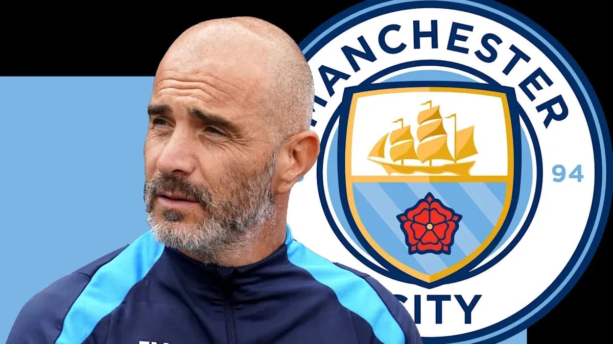 Coach with Manchester City logo in background