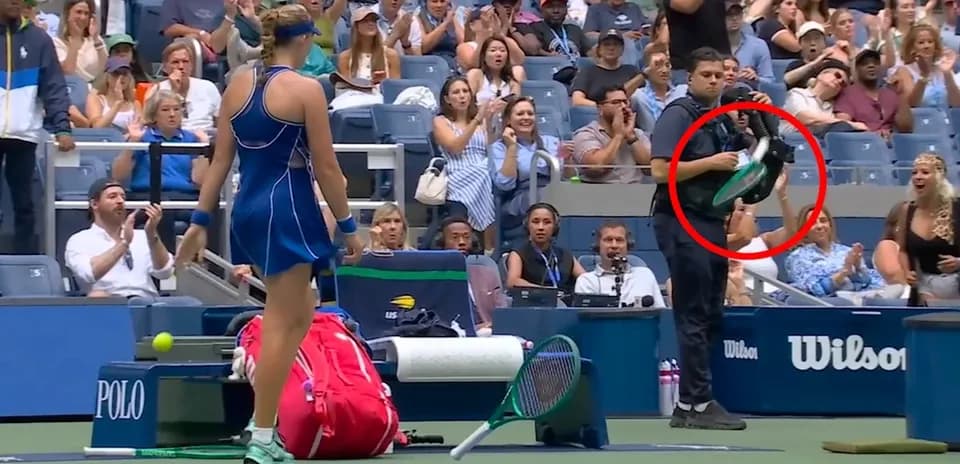 Player preparing to serve with audience applauding