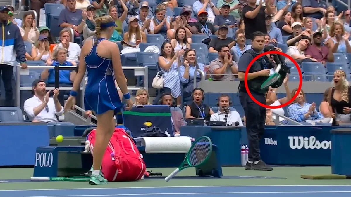 Player preparing to serve with audience applauding