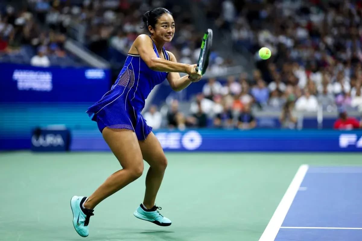 Player hitting a tennis ball during a match