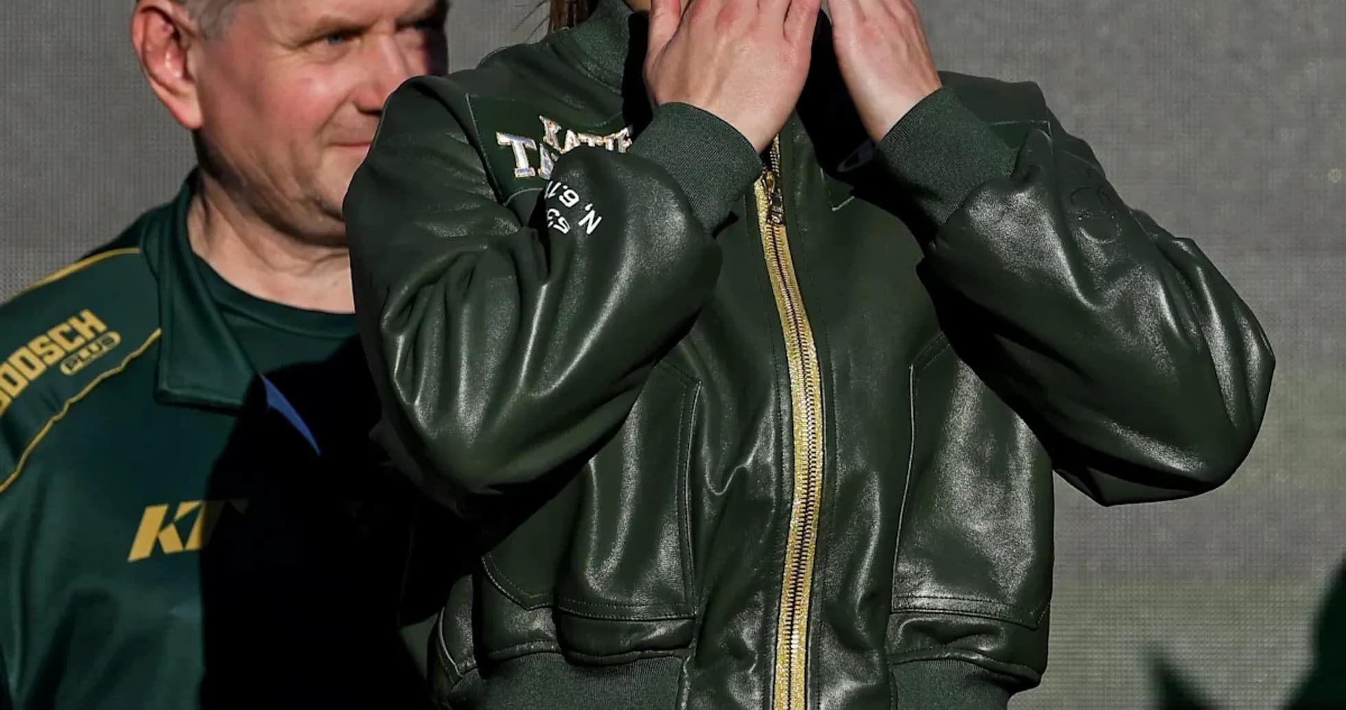 Female boxer blowing kisses at weigh-in event