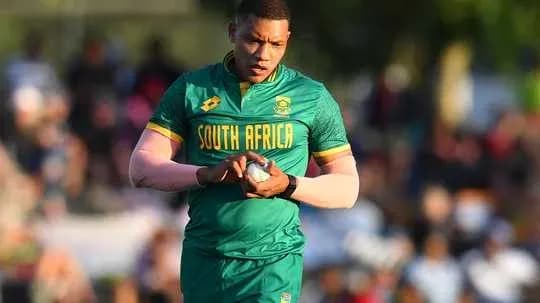 Rugby player preparing to kick during match