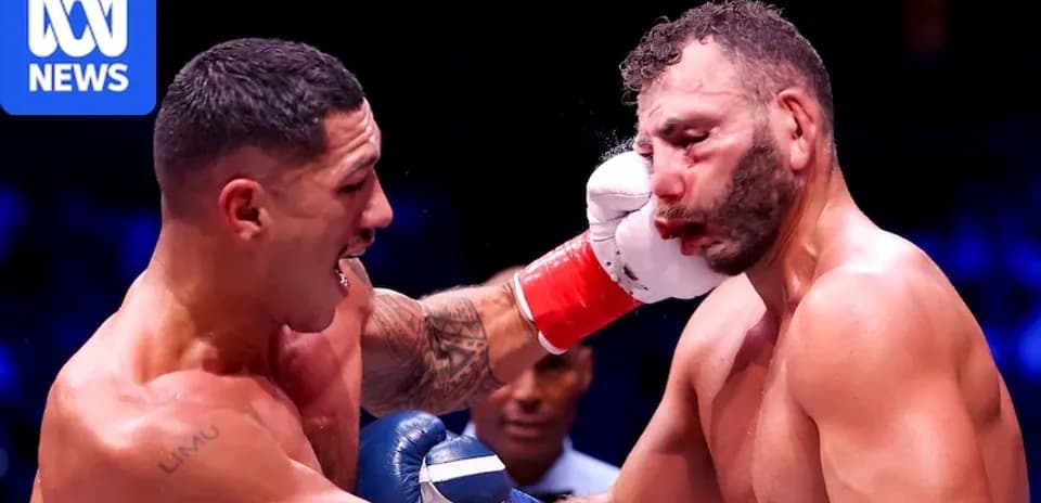 Boxer delivering a punch to opponent's face