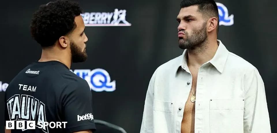 Two boxers facing off during a weigh-in event