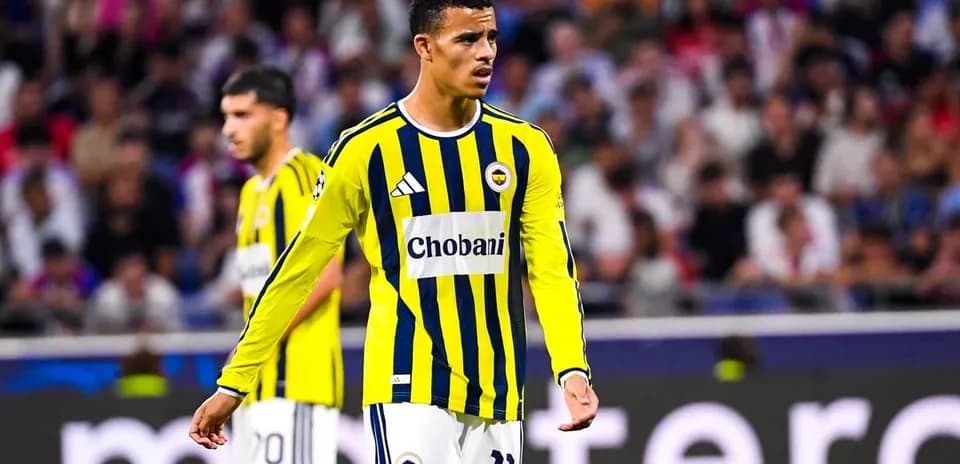 Player in yellow and blue jersey on the field