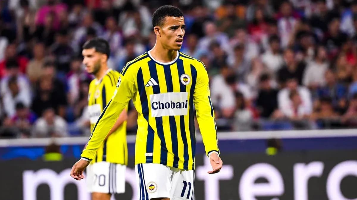 Player in yellow and blue jersey on the field