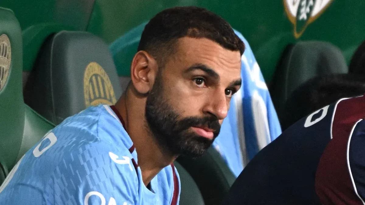 Player sitting on bench during match