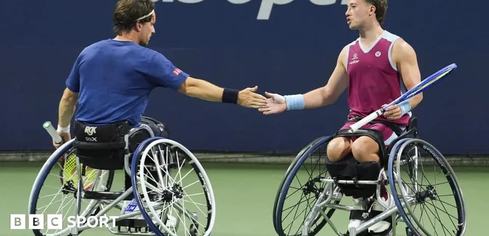 Two wheelchair tennis players shaking hands after match