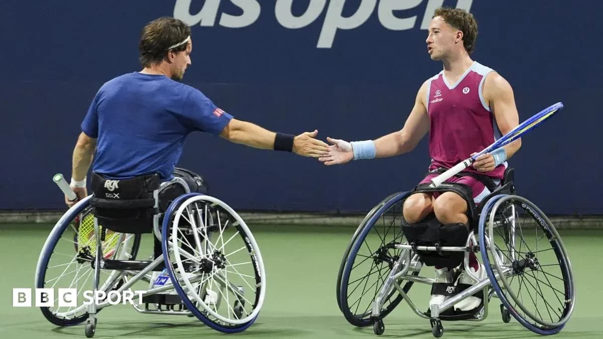Two wheelchair tennis players shaking hands after match