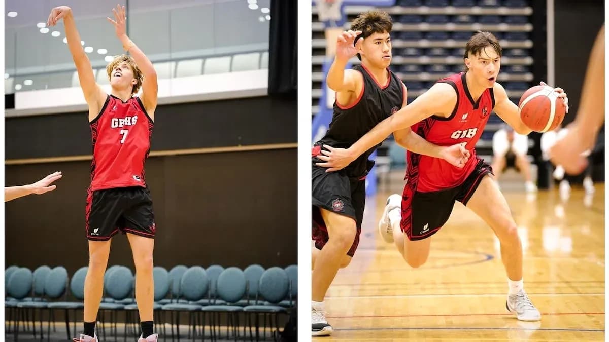 Two basketball players in action during practice