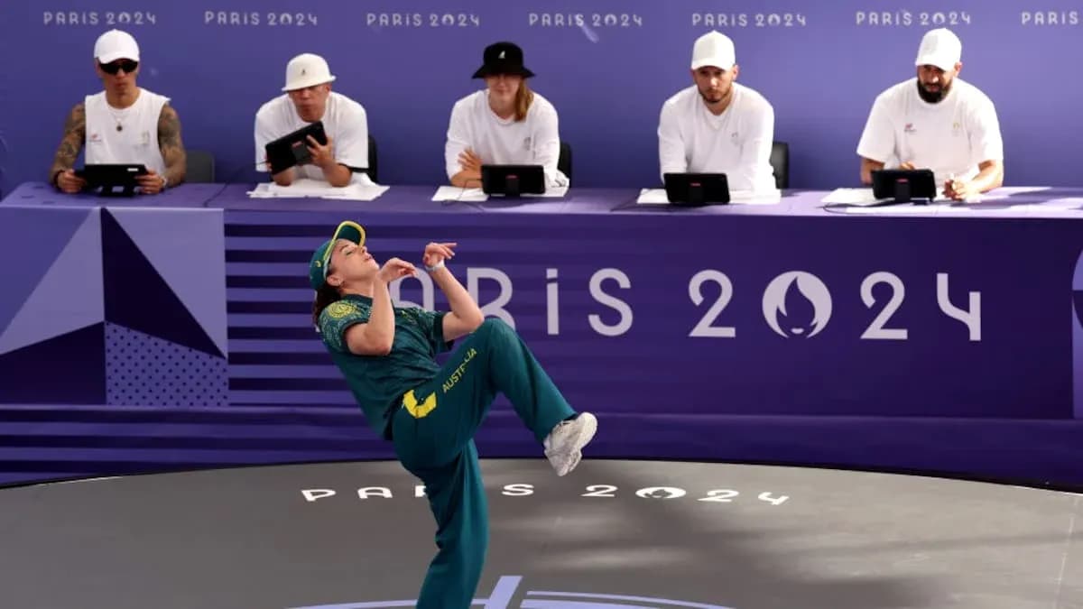 Athlete performing in front of judges at Paris 2024