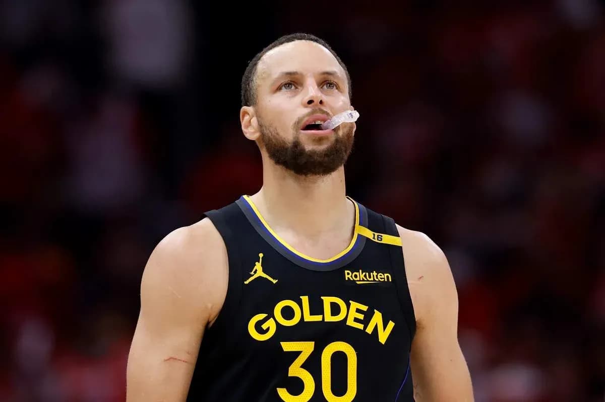 Player wearing Golden State Warriors jersey on court