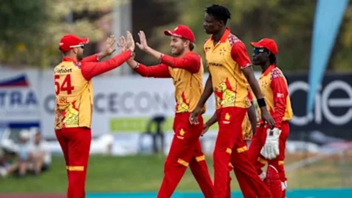 Players celebrating a wicket during cricket match