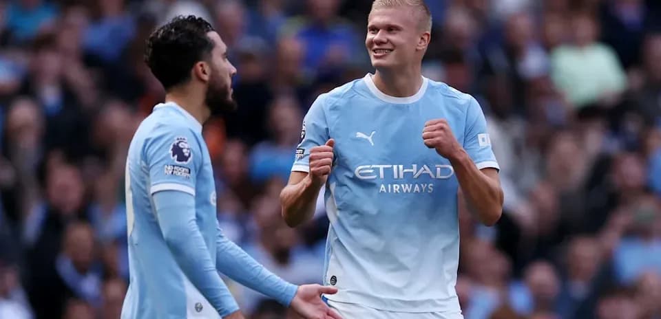 Manchester City players celebrating during a match