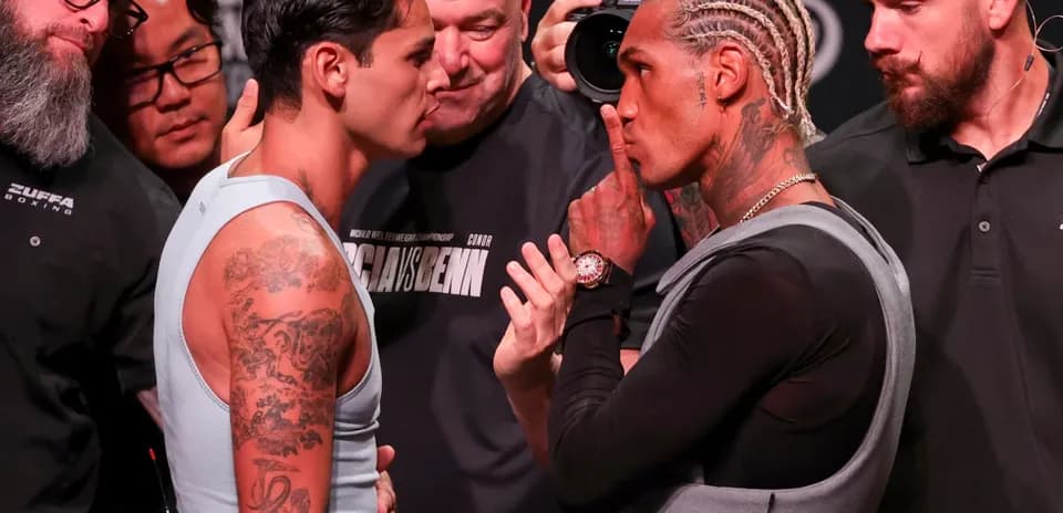 Two boxers facing off at weigh-in event