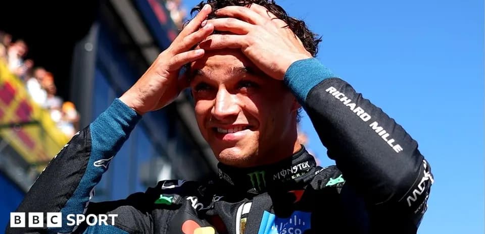 Driver celebrating after race with hands on head