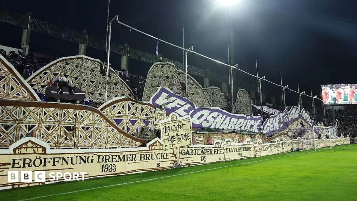 Fans displaying banners in stadium stands Fans displaying banners in stadium stands