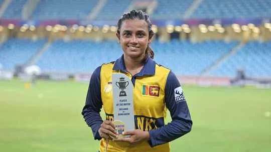 Player holding Player of the Match trophy Player holding Player of the Match trophy