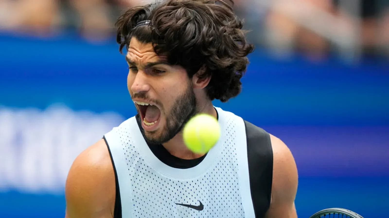 Tennis player celebrating with ball in motion Tennis player celebrating with ball in motion