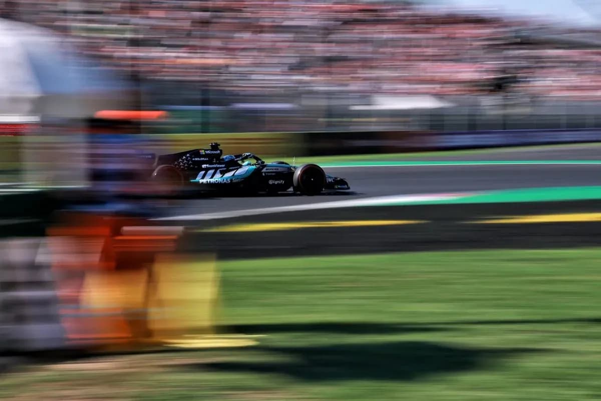 Formula 1 car racing on track with blurred background Formula 1 car racing on track with blurred background