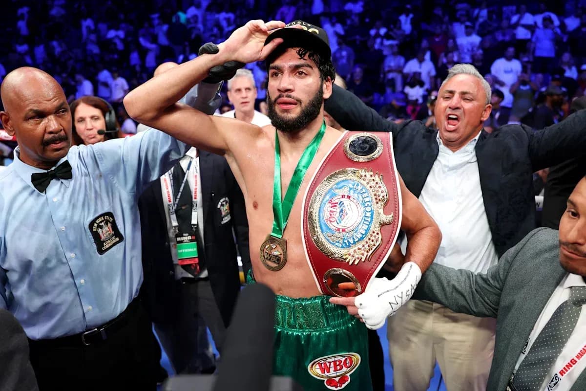 Boxer celebrating with championship belt after victory Boxer celebrating with championship belt after victory