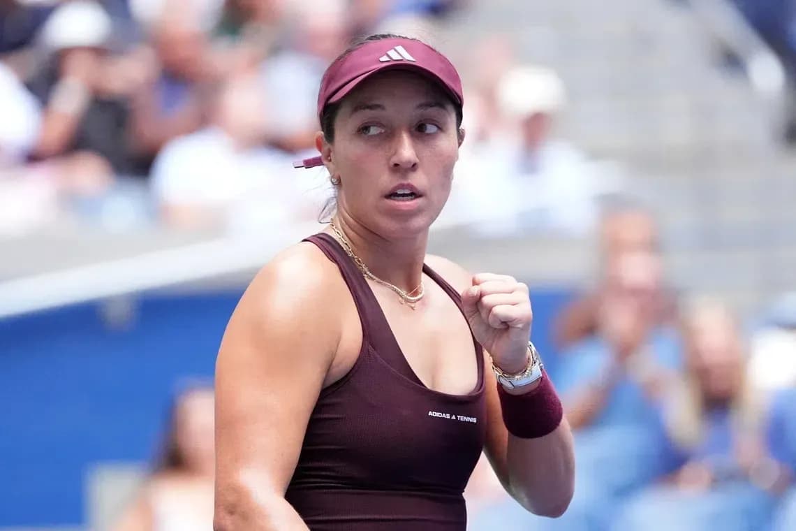 Tennis player celebrating during a match Tennis player celebrating during a match