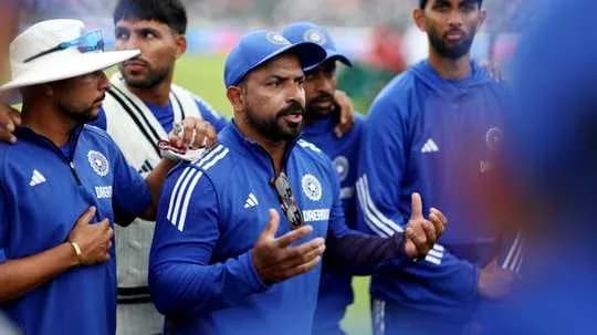 Cricket coach addressing team during huddle Cricket coach addressing team during huddle