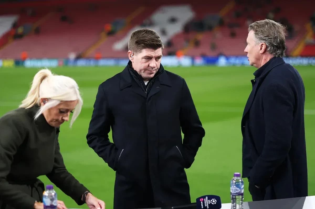 Three sports analysts discussing on the pitch Three sports analysts discussing on the pitch