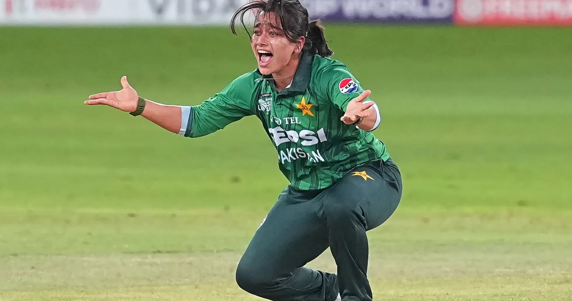 Pakistan player celebrating a catch on the field Pakistan player celebrating a catch on the field
