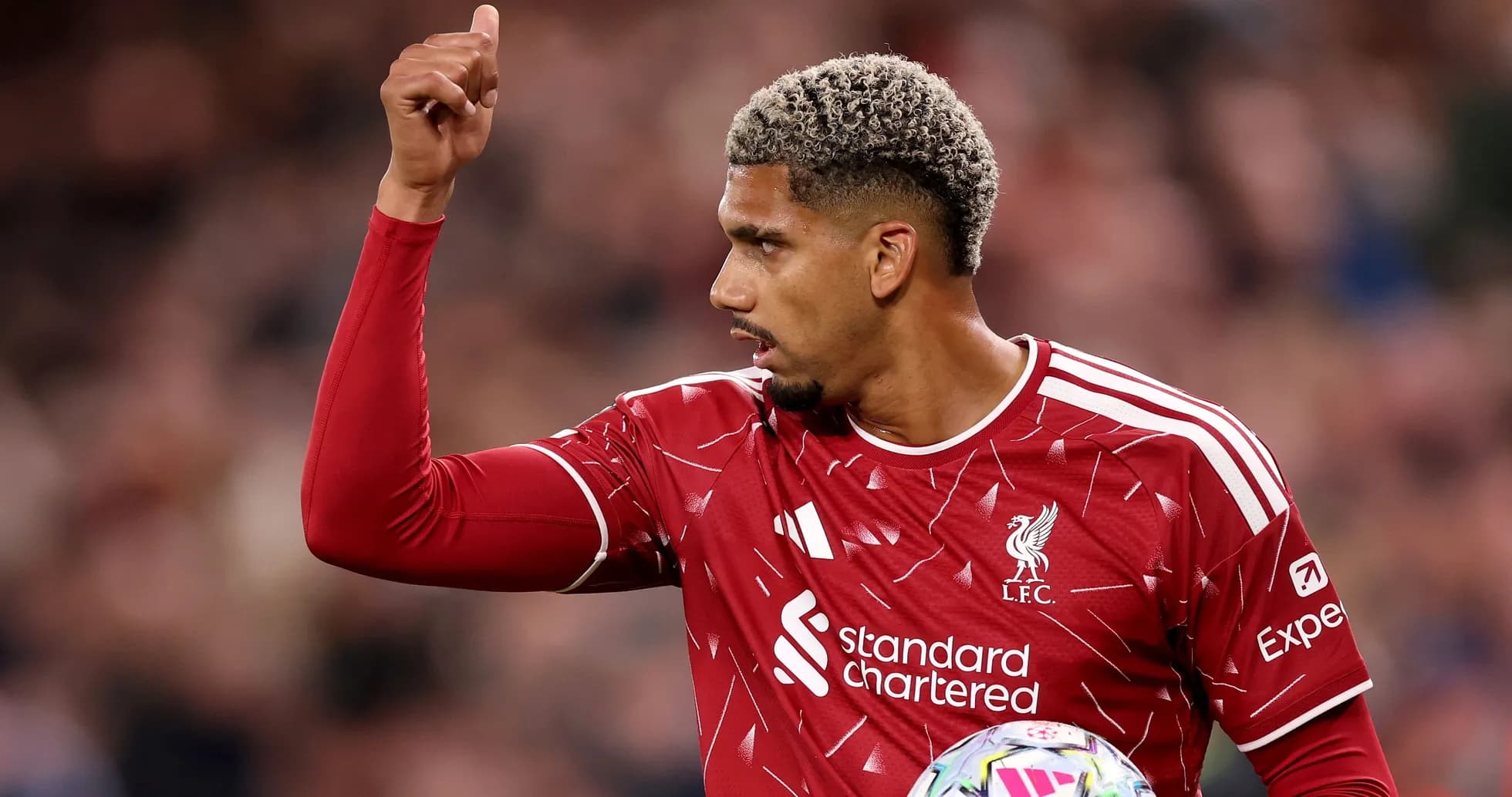 Liverpool player signaling during a match Liverpool player signaling during a match